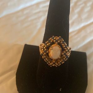 Sapphires around an Opal